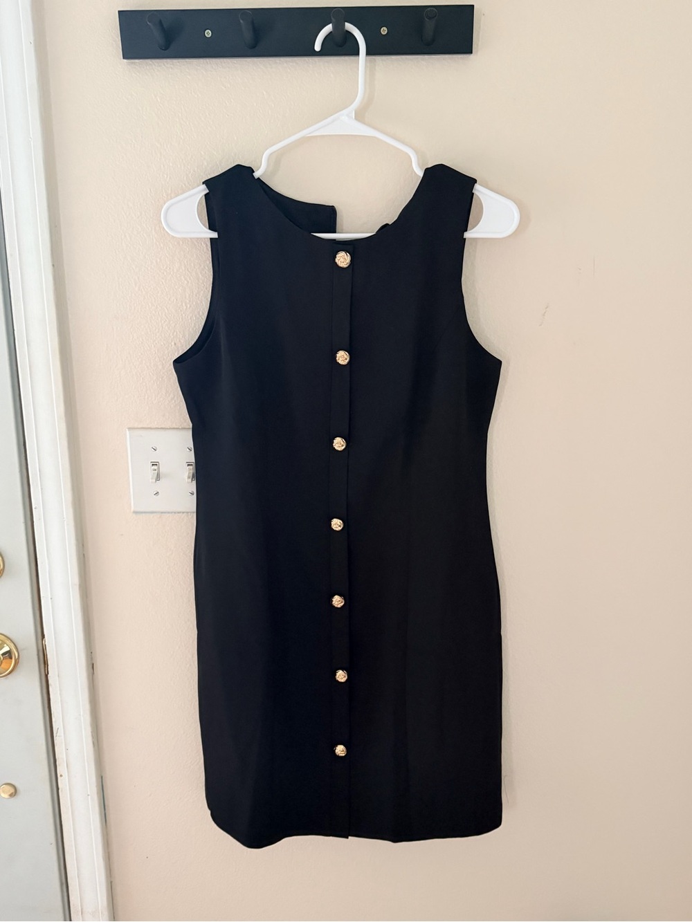 Classic Black Sleeveless Shift Dress with Gold Buttons